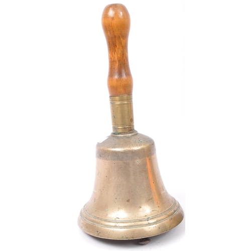 296 - A 19th century Victorian brass hand held bell with turned wood handle together with an early 20th ce... 