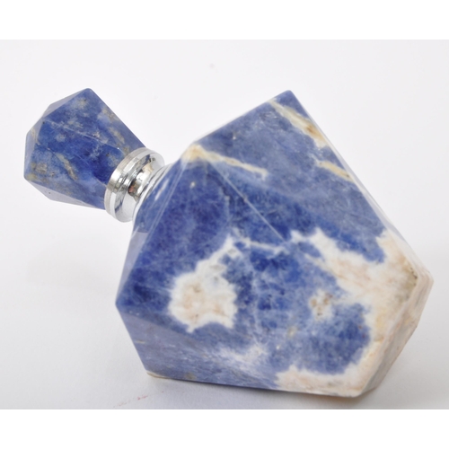 302 - A vintage 20th century lapis lazuli faceted carved scent perfume bottle. The bottle having faceted s... 