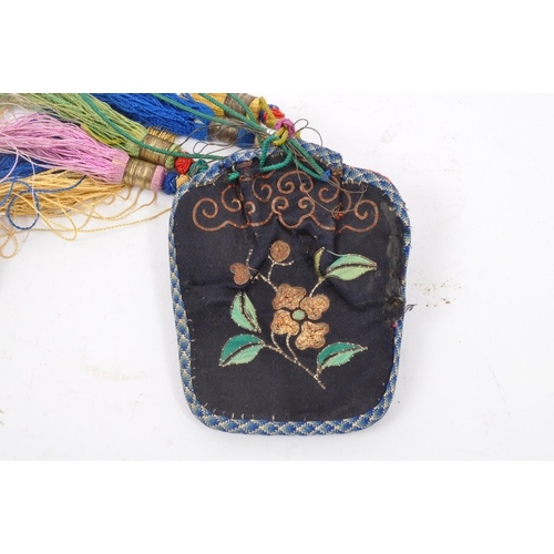 305A - A 19th century Chinese Oriental hand sewn ladies money back with hanging tassels and floral decorati... 