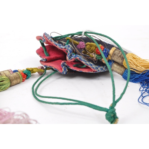 305A - A 19th century Chinese Oriental hand sewn ladies money back with hanging tassels and floral decorati... 