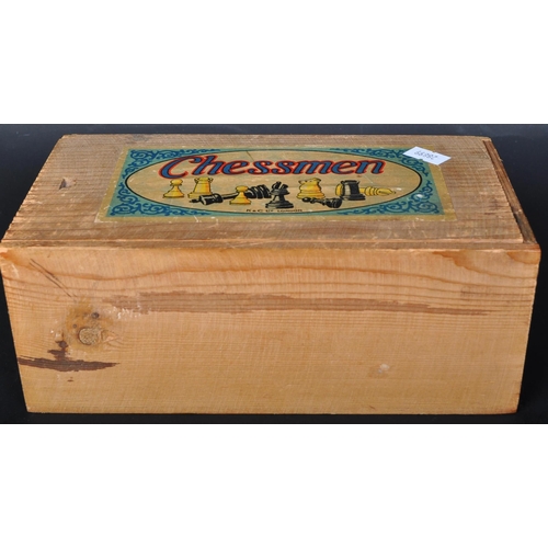 320 - A retro vintage 20th century K & C Ltd Chessmen chess pieces in wooden box with sliding top. The box... 