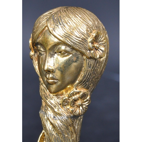 325 - A 20th century Art Nouveau style brass desk seal in the shape of a lady's head. The base decorated w... 