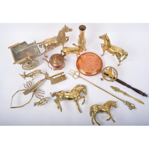 329 - A collection of 20th Century brass wares. To include; nut roaster, horse & cart, stags, companion se... 