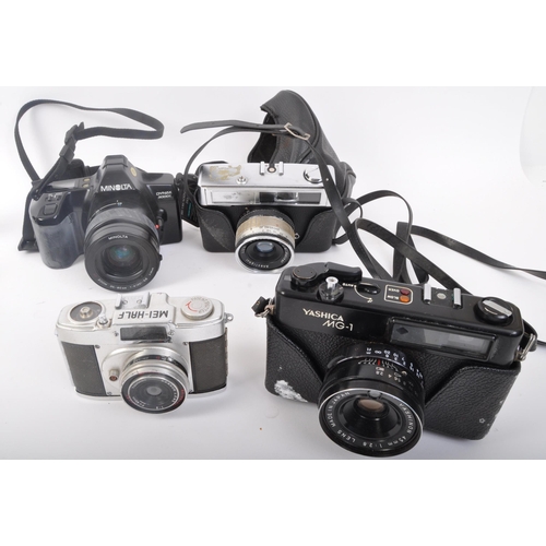 331 - An assortment of retro vintage 20th century photographic cameras. The lot to include a Minolta Dynax... 