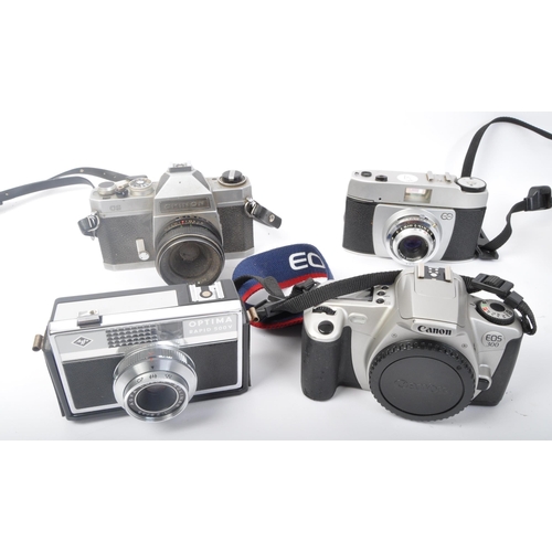 331 - An assortment of retro vintage 20th century photographic cameras. The lot to include a Minolta Dynax... 