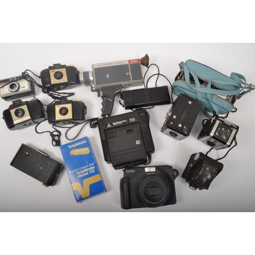 336 - An assortment of retro vintage 20th century photographic cameras & equipment. The lot to include two... 