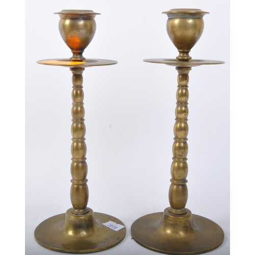 343 - A pair of 19th century Victorian brass candlesticks with tapered beaded form with bladed drip tray r... 