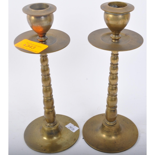 343 - A pair of 19th century Victorian brass candlesticks with tapered beaded form with bladed drip tray r... 