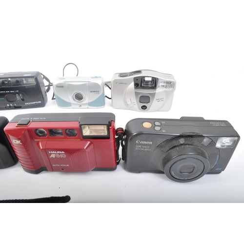 349 - An assortment of retro vintage 20th century photographic cameras. The lot comprising of a Canon Sure... 