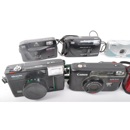 349 - An assortment of retro vintage 20th century photographic cameras. The lot comprising of a Canon Sure... 