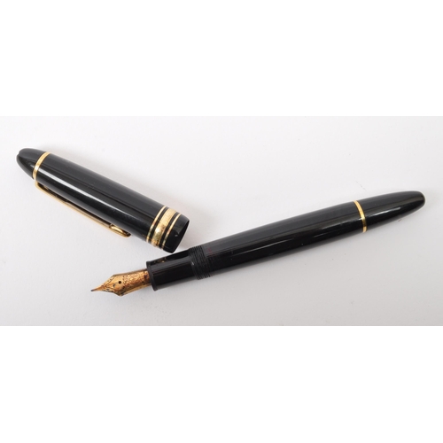 353A - A Montblanc Meisterstuck no. 146 writing ink pen. The pen having a black plastic body with gilt clip... 