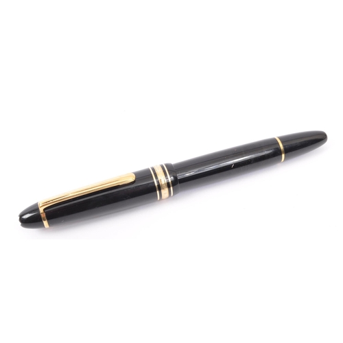 353A - A Montblanc Meisterstuck no. 146 writing ink pen. The pen having a black plastic body with gilt clip... 