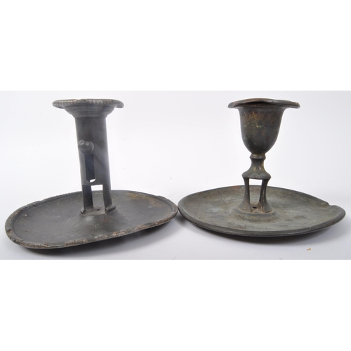 355 - A pair of 19th Century pewter candles holders. One having a flared top with central column with push... 