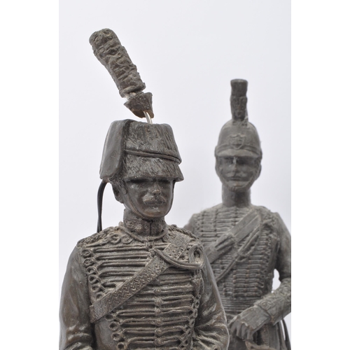 375 - A pair of 20th century bronzed effect resin Napoleonic figures together with two bronze horse figure... 