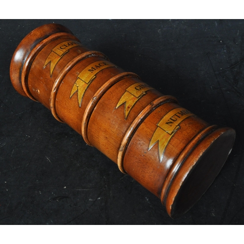 376 - A 20th century George III style fruitwood four section spice tower. The tower having a nutmeg, mace,... 