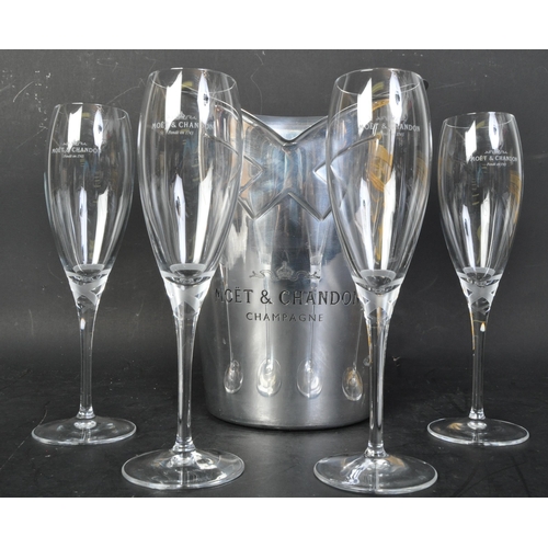 378 - A 20th century silver plated Moet & Chandon champagne bucket with six matching flute glasses. The bu... 