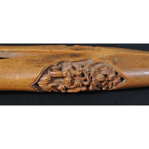 379 - A 19th Century carved wood peg / paper clip holder. Having intricate carved small detailing of Asian... 