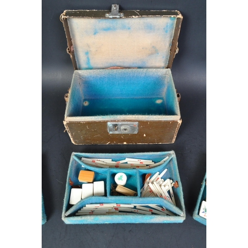 382 - A 20th Century circa 1930's Chinese Mah-jong set. With bone and bamboo counters worn leather case an... 