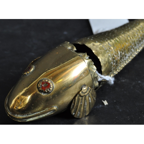 383 - A vintage 20th Century Japanese / Indian brass Koi carp fish sculpture with red enamel eyes. Having ... 