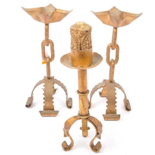 393 - A pair of mid 20th century Brutalist style gilded metal hand soldered candlesticks in the manner of ... 