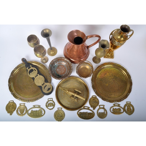 394 - An assorted collection of brass and coppers ware to include a 19th century Victorian hammered copper... 