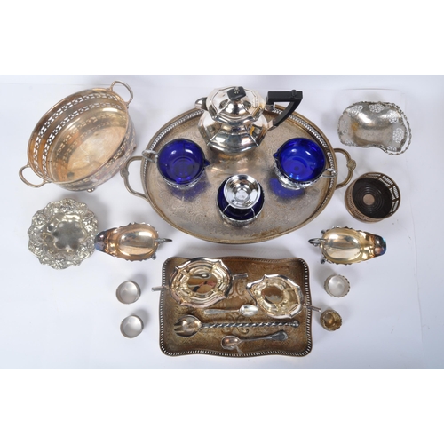 395 - An assortment of 20th century silver plated items to include wine trays, napkin rings, creamers, hot... 