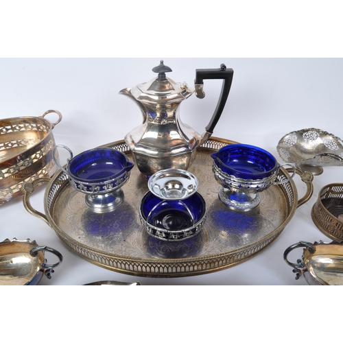 395 - An assortment of 20th century silver plated items to include wine trays, napkin rings, creamers, hot... 