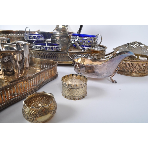 395 - An assortment of 20th century silver plated items to include wine trays, napkin rings, creamers, hot... 