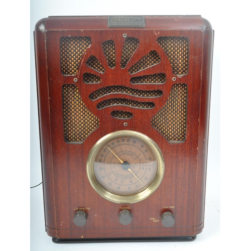 415 - A retro vintage 20th century Bush valve radio with three frontal tuning dials on central stations fa... 