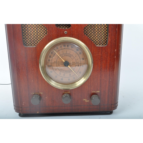 415 - A retro vintage 20th century Bush valve radio with three frontal tuning dials on central stations fa... 