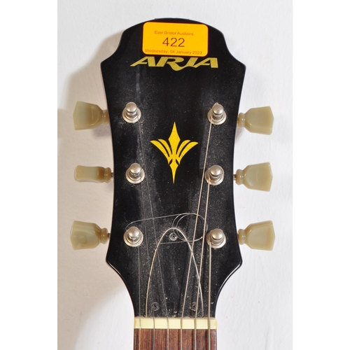 422 - Aria Guitars  - Model No. TA-40-LVSB - An Aria left handed electric guitar with a hollow body in che... 