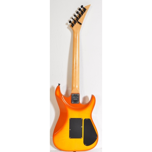 424 - Charvel Guitar - Serial No. 331121- An Charvel left handed electric guitar with an orange sunburst b... 