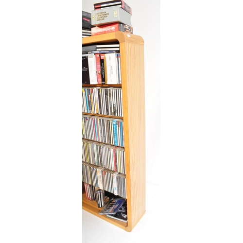 425A - A large collection of approximately 200 CDs within bookcase, largely classical music genre in stand.