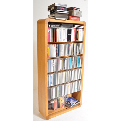 425A - A large collection of approximately 200 CDs within bookcase, largely classical music genre in stand.