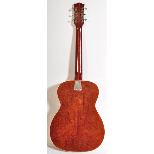 429 - Eko Guitars - A vintage Eko acoustic guitar with a hollow body with decorated ebonised sound holes a... 