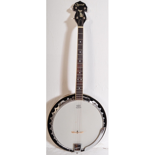 432 - An Ozark Banjo. The instrument set up for left handed use, faux mother of pearl inlay fret markers. ... 