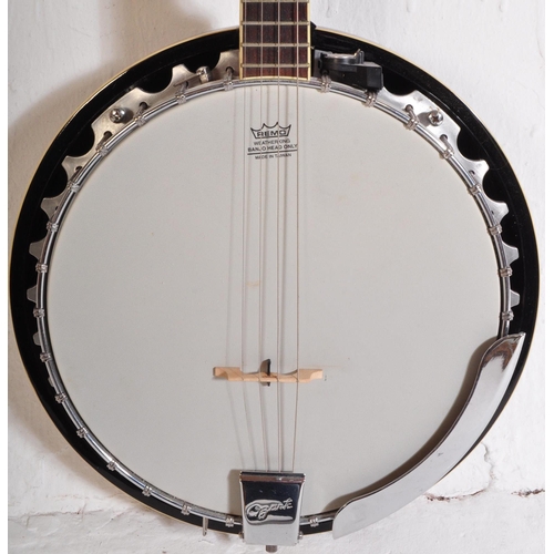 432 - An Ozark Banjo. The instrument set up for left handed use, faux mother of pearl inlay fret markers. ... 