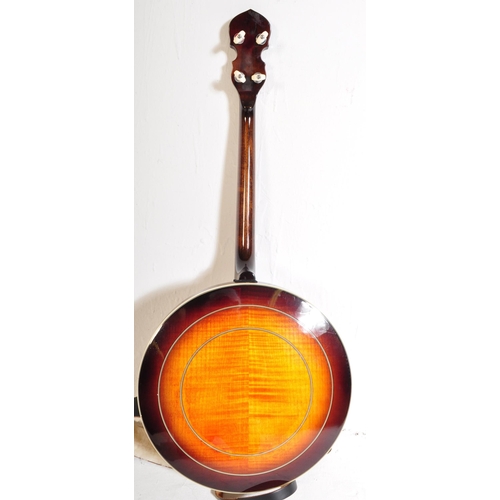 435 - Gold Tone Banjo. The instrument set for left handed use. Having a decorated inlaid head stock with f... 