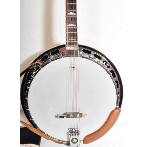 435 - Gold Tone Banjo. The instrument set for left handed use. Having a decorated inlaid head stock with f... 