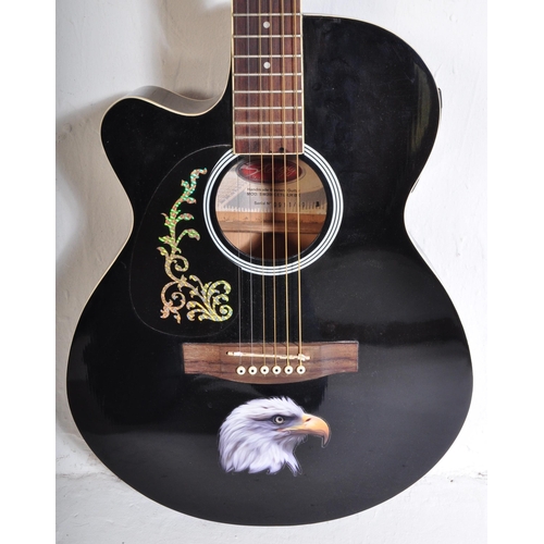 437 - Stagg Guitars - Serial No. 0911/69 - A Stagg left handed electric / acoustic guitar with a hollow bo... 