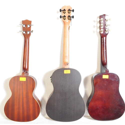 444 - Three vintage & later ukuleles. The lot to include a Supernylgut by Aquila ukulele, Arcade 1908 JG-C... 