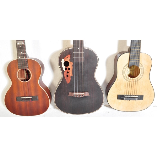 444 - Three vintage & later ukuleles. The lot to include a Supernylgut by Aquila ukulele, Arcade 1908 JG-C... 