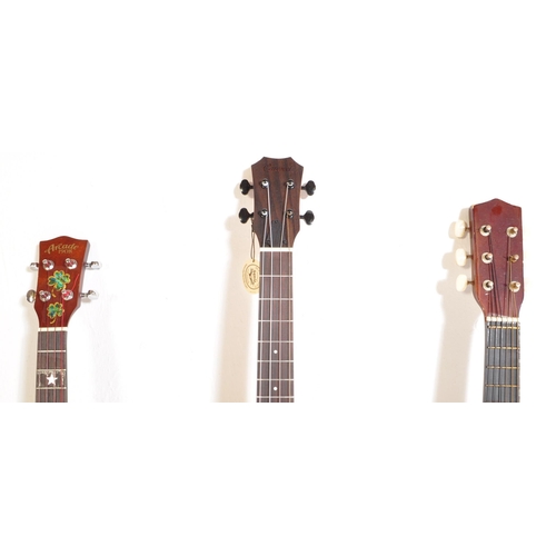 444 - Three vintage & later ukuleles. The lot to include a Supernylgut by Aquila ukulele, Arcade 1908 JG-C... 