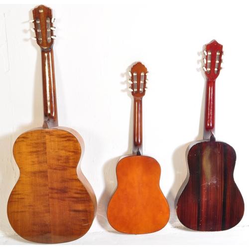 446 - A collection of three vintage acoustic guitars of various sizes. The lot to include a quarter size V... 