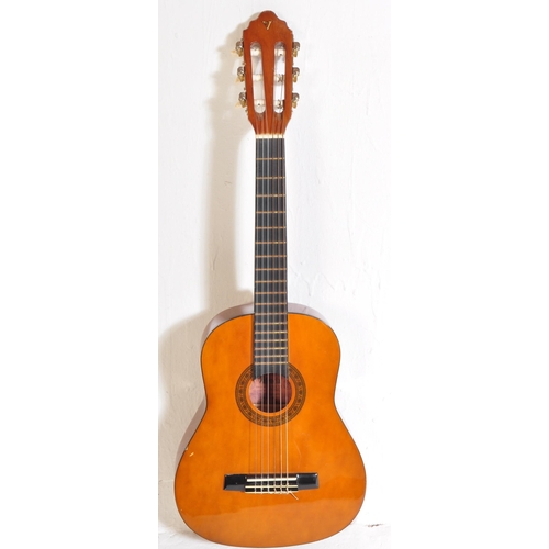 446 - A collection of three vintage acoustic guitars of various sizes. The lot to include a quarter size V... 