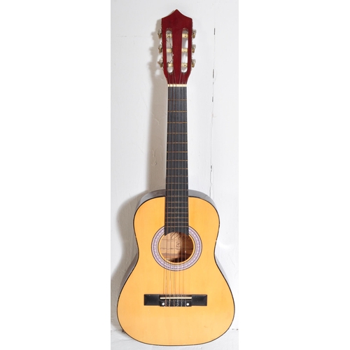 446 - A collection of three vintage acoustic guitars of various sizes. The lot to include a quarter size V... 