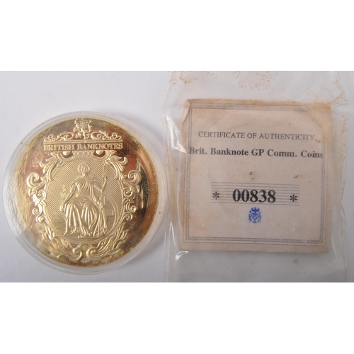 449 - An assortment of vintage 20th century commemorative coins & medals. The lot to include a one ounce 9... 