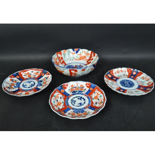 45A - A collection of four Imari vintage 20th Century Japanese oriental Asian plates and bowl. Of blue, wh... 