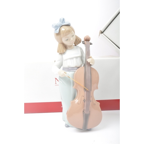 46 - Nao  – 02001879 'Girl With Cello’ & 02000534 'Angel Cuddles’ - original Nao Hand Crafted Porcelain s... 