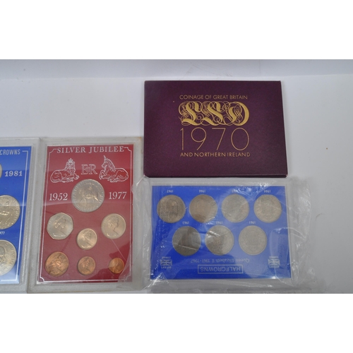 465A - A large collection of vintage 20h century commemorative coins sets. The lot to include two 1970 coin... 